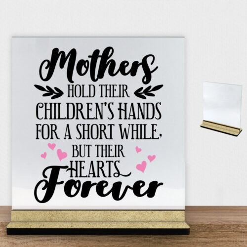 Mothers hold their children's hands... - design 2 | Glasskilt inkl. fod (træfiber)