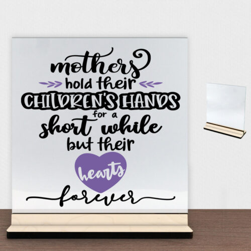 Mothers hold their children's hands... | Glasskilt inkl. fod (poppel krydsfinér)