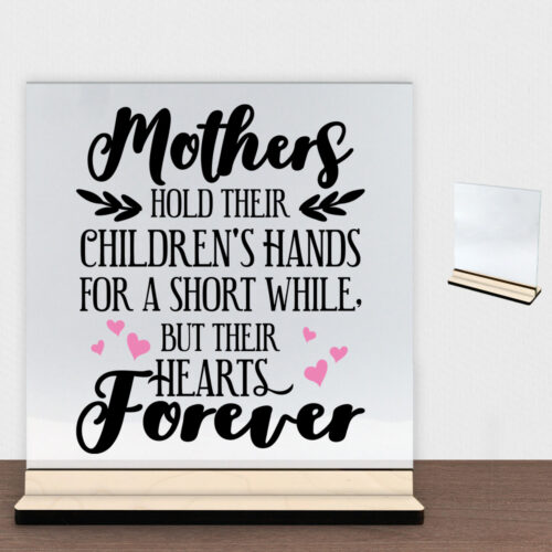 Mothers hold their children's hands... - design 2 | Glasskilt inkl. fod (poppel krydsfinér)