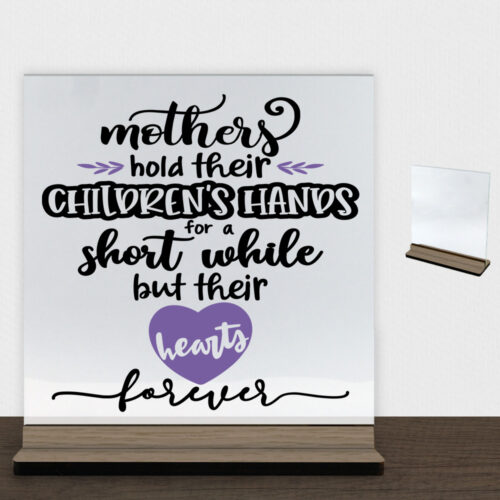 Mothers hold their children's hands... | Glasskilt inkl. fod (træfinér)