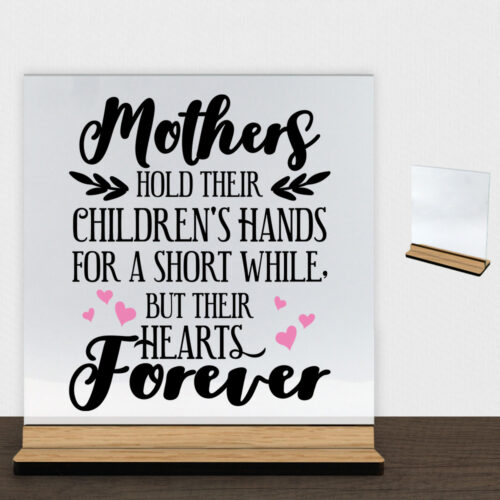 Mothers hold their children's hands... - design 2 | Glasskilt inkl. fod (træfinér)